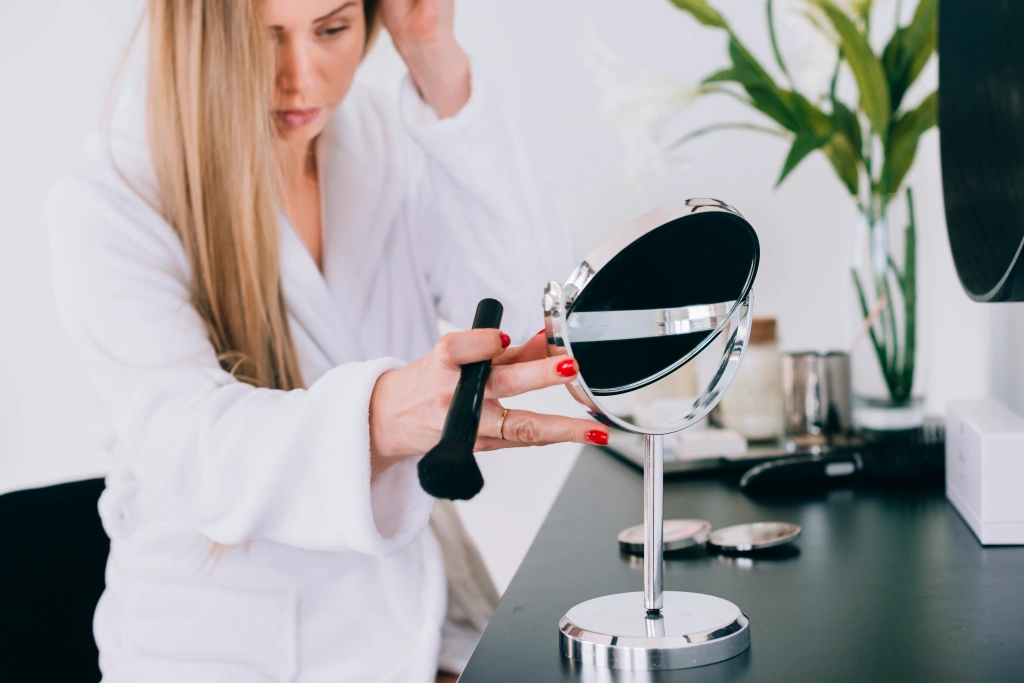 girl-doing-her-make-up-bathroom.webp